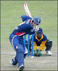 England's Andrew Strauss hits a drive