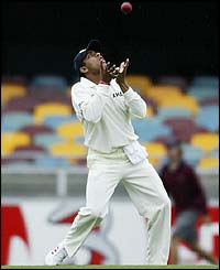 India's Akash Chopra takes a catch to dismiss Stuart McGill 