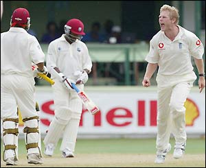 Sarwan begins the walk back to the pavilion after being caught by Ashley Giles