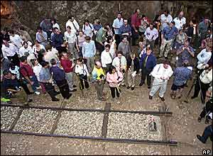 Relatives of victims gather around the dead end of the train tracks at Hellfire Pass in Kanchanaburi Province, 110 kilometers west of Bangkok on Sunday