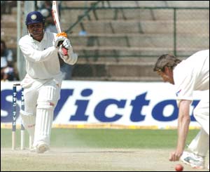 Sehwag drives past McGrath