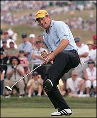 Fred Funk sinks a par putt on the eighth hole