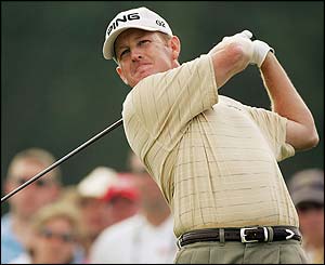 Jeff Maggert drives down the ninth