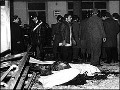 Police and others inside bomb-damaged bank, Milan