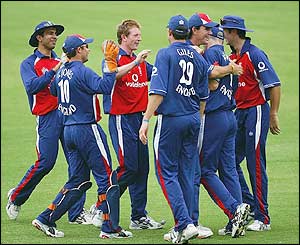 Paul Collingwood and his England colleagues celebrate taking the wicket of Gavin Ewing 