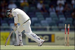 Justin Langer is bowled by Pakistan's Abdul Razzaq 