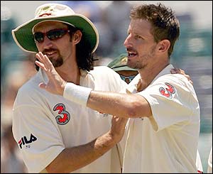 Australia's Jason Gillespie congratulates Michael Kasprowicz 