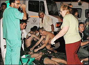Emergency workers attend to the injured outside a club in Buenos Aires, Argentina