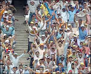 The Indian crowd join in the celebrations as Pakistan struggle to reach India's first-innings total