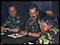 Generals sitting round table with documents 