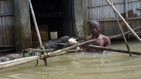 Man trapped by flooding in Benin