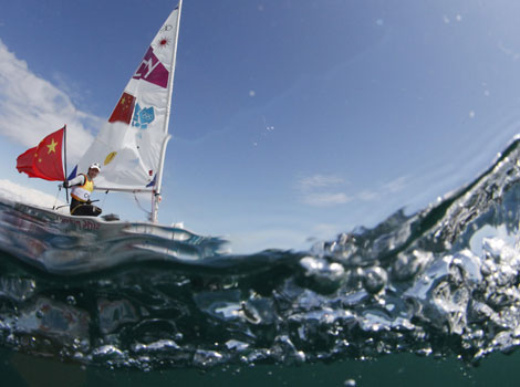 Xu Lijia crosses the finish line to win gold in the women's Laser Radial class