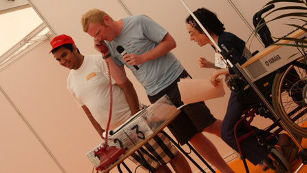 Liz Carr speaks to the banker during DLA or no DLA