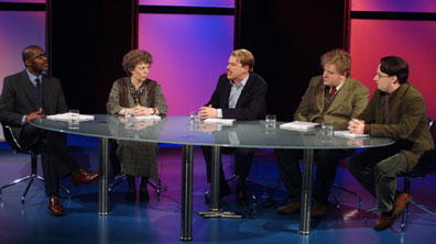 Robert as Raymond Terrific, surrounded by boffins