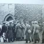 This picture shows Reverend Ernets Boggs leading the funeral procession of a US airman killed on his return to Eglinton airbase.