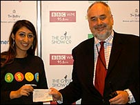 The cheque is presented at the Golf Show