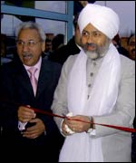 Baba Ji cuts ribbon