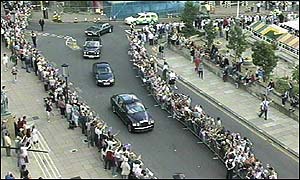 Picture: crowds line the street outside City Hall.