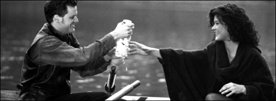 A man and a woman in a rowing boat