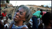 An earthquake survivor weeps in a shantytown on the outskirts of Port au Prince, Haiti