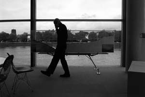 Norman Foster paces up and down in front of the model of the Millau viaduct.