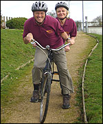 Two people on a bicycle
