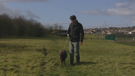 Rhodri Owen walks a dog
