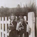 Audrey (left) and Shirley Lloyd as they waited to get on the bus taking them out of Southend in 1940. They wore skirts, blazers and little rucksacks made by their mother, a dressmaker.