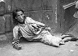 Starving woman in the Warsaw ghetto