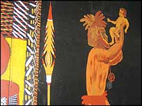 Ježíška drží nad hlavou zarostlý domorodec