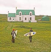people with surfboards on Tiree
