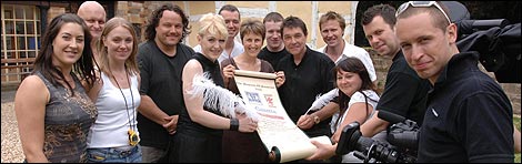 The crew from Most Haunted sign the scroll