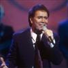 Sir Cliff Richard performing on stage
