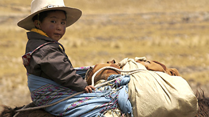 Rodolfo and Gladys' son Icka takes a donkey ride