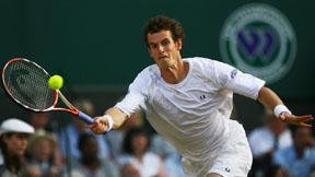 Andy Murray reaching for a forehand at Wimbledon.