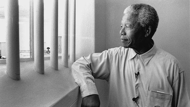 Nelson Mandela revisits his prison cell on Robben Island in 1994, where he had spent 18 of his 27 years in prison.