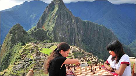 Women's world chess champion Alexandra Kosteniuk from Russia, left, plays Peruvian Under-16 world chess female champion Deysi Cori during one of a set of friendly games at the Inca citadel of Machu Picchu.