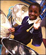 Girl playing the Steel-pans.
