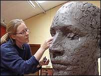 Caro Sweet working on her sculpture
