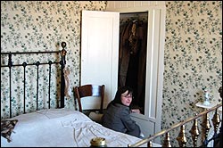 Sally Nightingale from DH Lawrence Heritage in the bedroom where the wallpaper was found