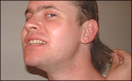 Rich Fisher shows off his locks