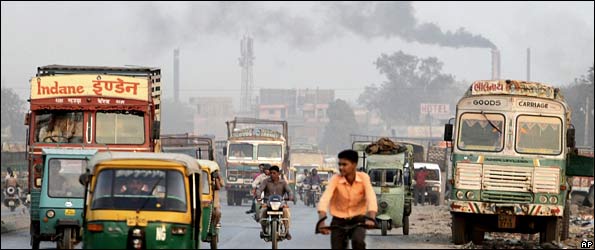 Cars and bikes on a road in India