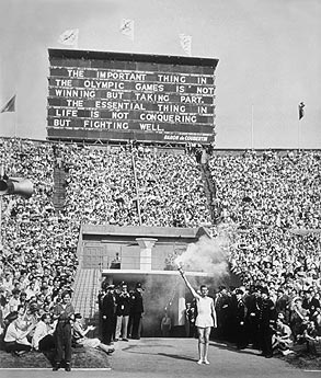The final runner of the torch relay enters Wembley stadium