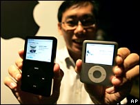 Man with two iPods