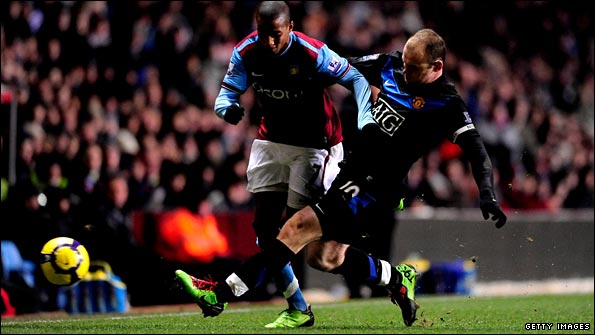 Wayne Rooney races back to tackle Ashley Young