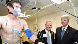 Health Secretary Andrew Lansley (right) inspects a new tool to measure blood pressure