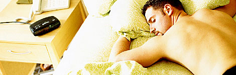 Man asleep in bed