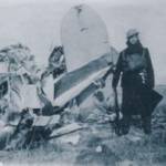 Tom guarding the shot down aeroplane