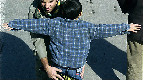 A security search of a child in Pakistan following an attack on a mosque by a teenage suicide bomber. Photo: Asif Hassan/AFP/Getty Images