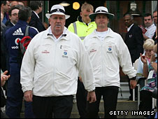 Darrell Hair and Simon Taufel walk out